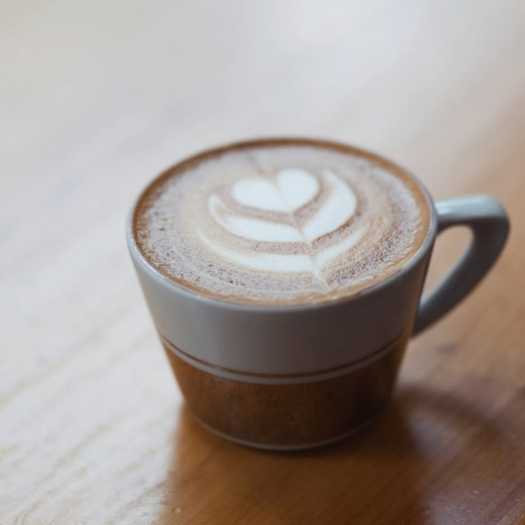 white gold mugs with latte art